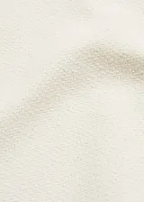 Minifalda color crudo de tejido mezcla de algodón con forro interior y cierre lateral de cremallera.