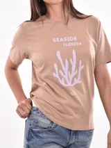 Remera blanca de algodón con estampado de limones y texto en azul.