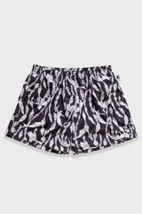 Short de baño negro con estampado de sirenas blancas y plantas marinas.