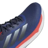 Championes de running azul, con detalles en rojo y suela blanca, diseñados para brindar comodidad y soporte durante la actividad física.