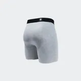 Bóxer negro de la marca Stance, con cintura elástica azul y logo de la marca en blanco en la pierna derecha.