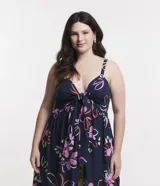 Blusa larga de viscosa con estampado floral, escote en V con lazo, breteles medianos y abertura frontal.