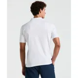 Polo blanco de tejido interlock con cuello clásico y tapeta de botones. Presenta logo Sticker Pete bordado en el pecho.