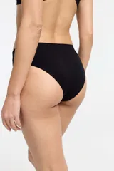 Bombacha de bikini azul con diseño de olas y tiro medio, confeccionada en microfibra seamless con fundillo 100% algodón.
