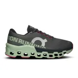 Championes de running On Cloudmonster 2, color negro con detalles en verde y rosa.