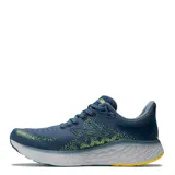 Championes de running New Balance Fresh Foam 1080 V12, color azul con detalles en amarillo y celeste.