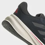 Championes de running Adidas Response, color azul oscuro con detalles en rojo y suela blanca. Presentan una horma clásica, capellada de malla transpirable, tres franjas laterales en tono oscuro y mediasuela de EVA.