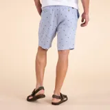 Short de calce relajado, confeccionado en lino orgánico con pequeños estampados inspirados en animales.