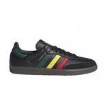 Championes Adidas Samba OG de cuero negro con detalles en verde, amarillo y rojo.
