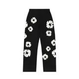 Pantalón de jogging negro con estampado de coronas de algodón blancas.