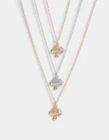 Set de tres collares metálicos con dije de hongo con strass y mariposa esmaltada.