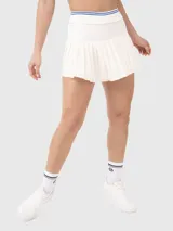 Falda blanca plisada con pretina elástica con detalles de líneas de color y calza incorporada con bolsillo. Ideal para tenis o pádel.