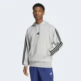 Canguro Adidas gris con capucha, cordón ajustable, bolsillo tipo canguro, hombros caídos, puños y dobladillo acanalados, dobladillo trasero ligeramente más corto y las icónicas tres rayas negras en las mangas.