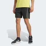 Shorts de training Adidas color negro con tres rayas grises a los costados. Confeccionados en tejido transpirable con tecnología CLIMACOOL, cintura elástica con cordón ajustable, aberturas laterales y bolsillos frontales con cierre.
