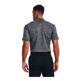 Remera polo Under Armour Matchplay para hombre, color gris jaspeado con logo negro en el pecho.