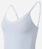 Conjunto de pijama compuesto por musculosa de rib color celeste con breteles finos y encaje en el escote, y short blanco con estampado de amuletos.