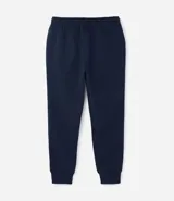 Pantalón de jogging negro, corte deportivo con puños ajustados en los tobillos y cintura con lazo. Confeccionado en algodón y poliéster con interior felpudo.