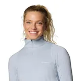 Remera deportiva Columbia Weekend Ascent Half Zip para mujer, color gris claro, de manga larga con orificios para los pulgares y cierre de media cremallera. Confeccionada con tejido transpirable Omni-Wick™ que absorbe la humedad y neutraliza los olores.