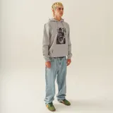 Canguro gris con capucha y cordones blancos. Estampado frontal con imagen de Batman tocando la guitarra.
