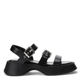 Sandalias de plataforma color beige con tiras anchas y hebillas doradas.