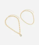 Collar dorado de doble cadena, una de eslabones y otra de eslabones con nudo, con colgante redondo.