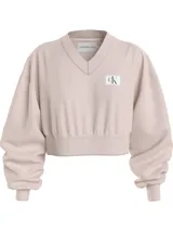 Buzo Calvin Klein Jeans color beige, de corte cropped, con cuello en V y logo bordado en el pecho.
