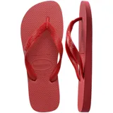Ojotas Havaianas Top color blanco, con suela texturizada y tiras con diseño en relieve y logo de la marca.