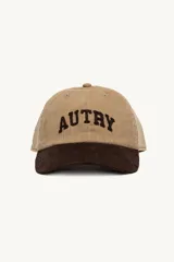 Gorra de béisbol color beige con visera marrón, confeccionada en pana. Presenta el logo 'AUTRY' bordado en marrón en el frente.