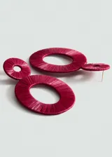 Aros colgantes con forma circular, color verde, hechos de rafia.