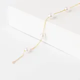 Pulsera de oro amarillo 18k con perlas cultivadas blancas.