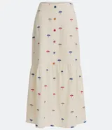 Pollera midi color crudo con estampado de sombrillas de colores. Tiene corte evasé, cintura alta con botones de colores y forro interior.