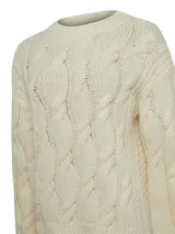 Sweater color crudo de lana de oveja y alpaca, con cuello redondo y diseño de trenzas.