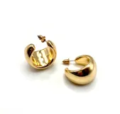 Aros de acero color dorado con diseño curvado y cierre de tuerca.