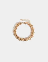 Pulsera dorada de eslabones gruesos con cierre de mosquetón y cadena de alargue.
