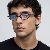 Lentes con filtro de luz azul y protección UV400, modelo Binti Tigris. Montura geométrica con estampado carey y lentes transparentes. Fabricados con material bio-based G850.