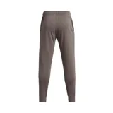 Pantalón de jogging gris jaspeado de Under Armour, modelo Rival Terry Jogger, para hombre. Confeccionado en tejido de felpa suave, con cintura elástica ajustable con cordón y logo de la marca estampado en la pierna izquierda.