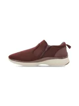 Zapatillas de mujer color bordó, sin cordones, con cierre lateral de cremallera y suela blanca.