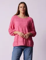 Blusa de broderie color blanco, de mangas largas con puños elásticos.