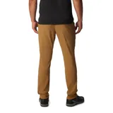 Pantalón de trekking color marrón claro, con protección solar UPF 50, repelente al agua y a las manchas. Cuenta con rodillas articuladas, puños cónicos, bolsillos con cremallera y detalles reflectantes.