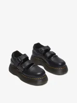 Zapato Mary Jane negro de cuero Milled Nappa, con dos correas ajustables con hebillas, cuello acolchado y una suela inflada de PVC con costura amarilla.