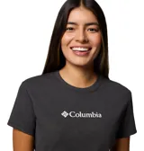Remera de mujer Columbia color gris oscuro, de corte clásico, con cuello redondo y mangas cortas. Logo de la marca estampado en el pecho. Confeccionada con tejido Omni-Wick™ que absorbe el sudor.