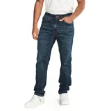 Pantalón de jeans de calce slim, color azul oscuro. Confeccionado con algodón y poliéster reciclado con spandex. Diseño de cinco bolsillos y logo CAT en la parte trasera.