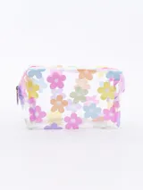 Neceser transparente con cierre superior y estampado de flores de colores pastel.