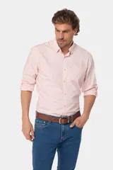 Camisa azul marino de manga larga con bolsillo en el pecho, confeccionada en algodón.