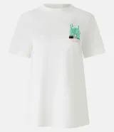 Remera color crema de algodón con cuello redondo y mangas cortas. Estampa en la espalda con el logo de Honeydukes y un dibujo de la tienda de dulces de Hogsmeade.