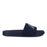 Chancletas azules con logo blanco en la tira superior.