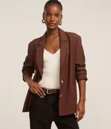 Blusa blanca sin mangas de punto acanalado con escote en V y espalda descubierta.