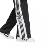 Pantalón deportivo Adidas Adibreak negro con rayas blancas laterales y botones a presión.
