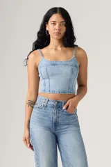 Cami top de jean celeste con breteles finos y strass plateados.