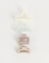 Set de cuatro broches para el pelo de diferentes formas y colores: blanco, celeste, rosa y beige.